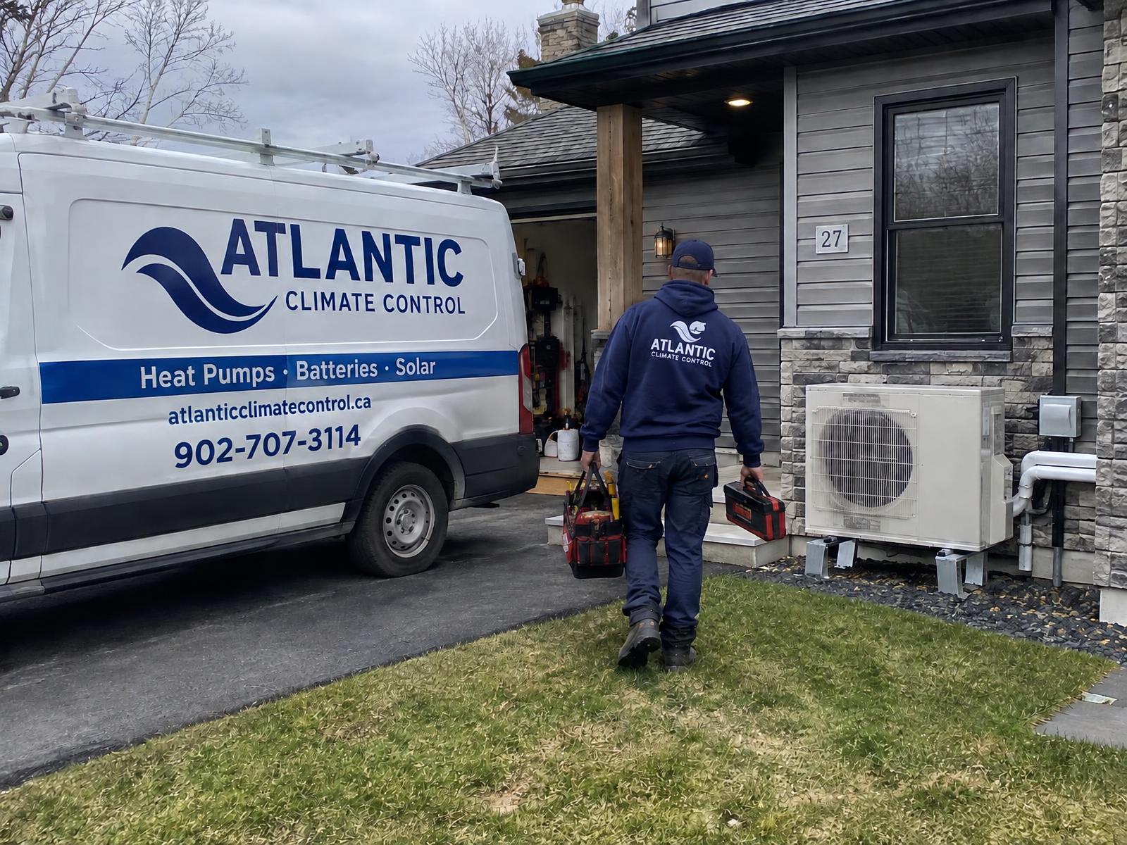 Illustration of an Atlantic Climate Control service van at a residential heat pump installation